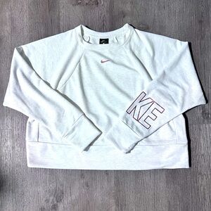 Nike cream colored crop sweater with subtle pink glittery details.